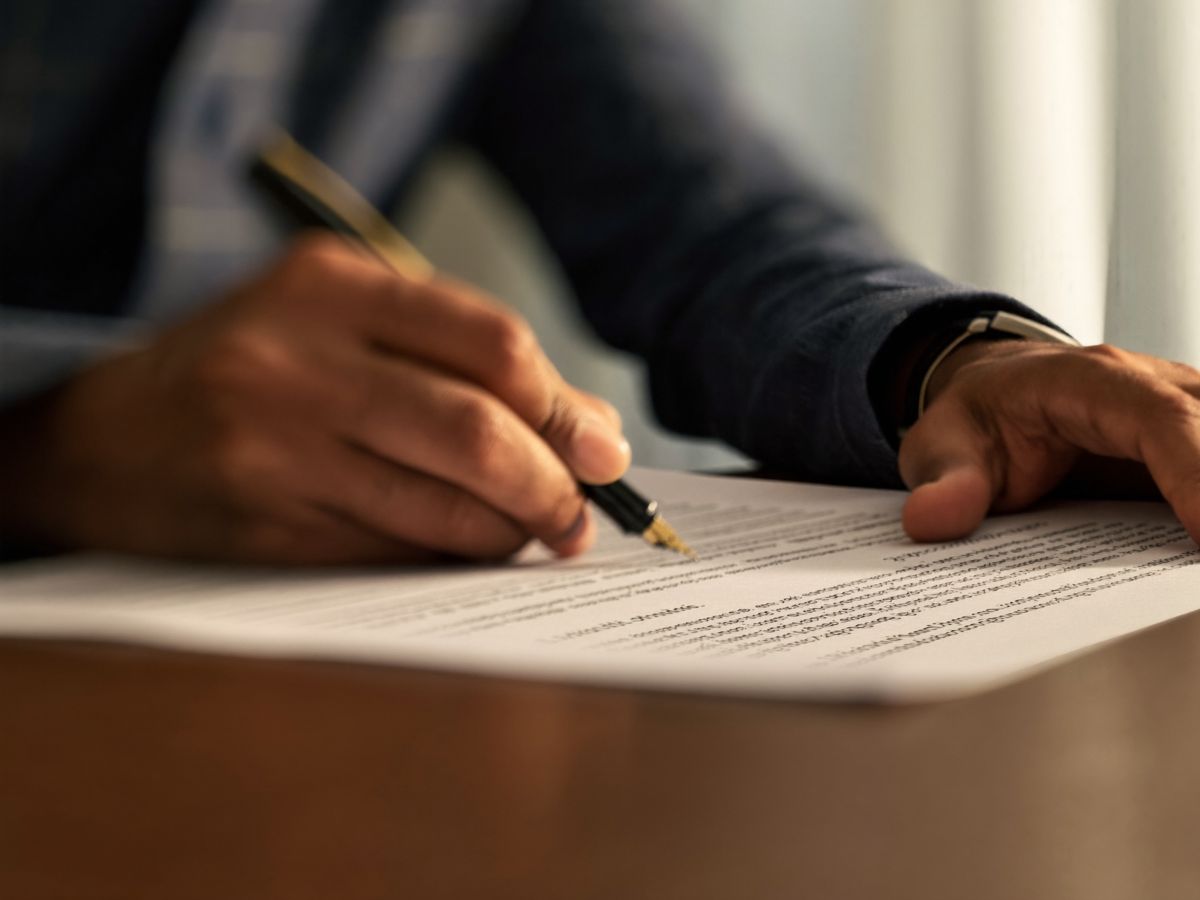 A founder signing incorporation papers